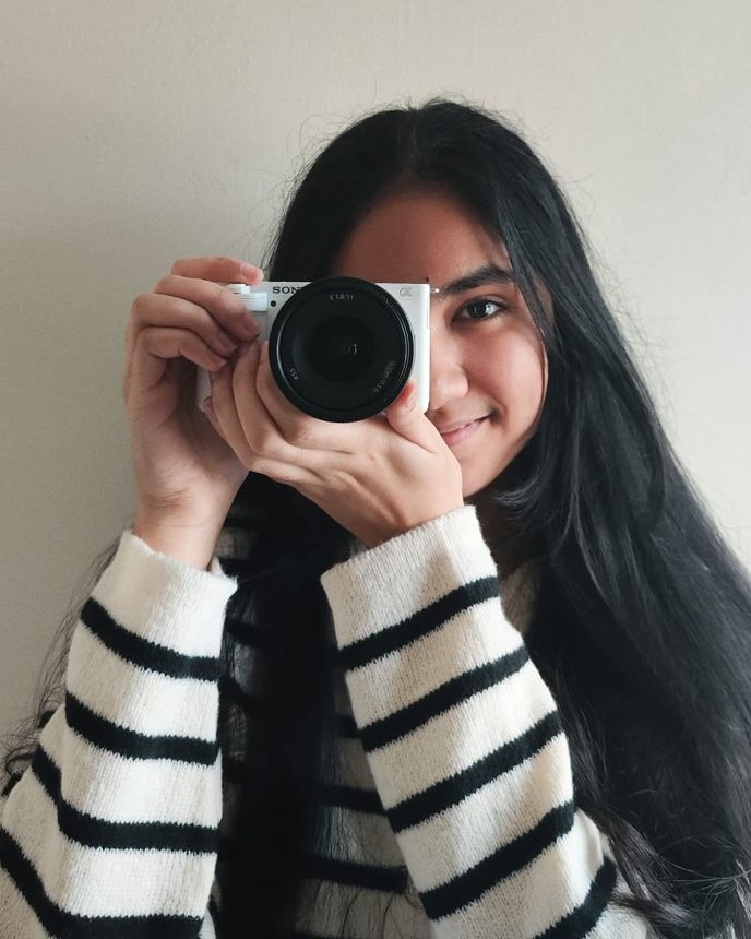 Maha Media CC founder holding a camera